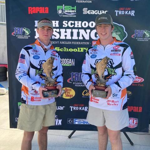 Photo submitted - Tallis Morrison, pictured left, and Max Heaton, right, pose for a photo with their first-place tropies after winning the Student Angler Federation’s regional qualifer over the weekend on Lake Hartwell.
