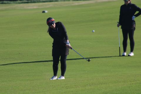 Sunshot by Grayson Williams Lauren Weaver chips a shot towards the green during a match at Cateechee on Thursday, April 1.
