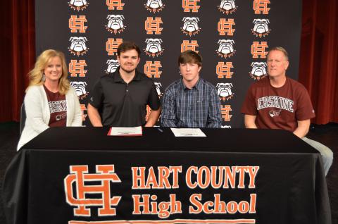 Sunshot by Drew Dotson - Max Heaton, second from right, poses for a photo with his parents Kevin, far right, and Jennifer Heaton, far left, alongside Erskine head bass fishing coach Ryan Teems, second from left, after Max signed a letter of intent on Friday, April 2 at Hart County High School to fish collegiately for Erskine College.