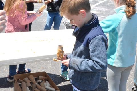 Drew Dotson/The Hartwell Sun - David Blackman smears peanut butter on an old toilet paper roll to make a tasty snack for birds.