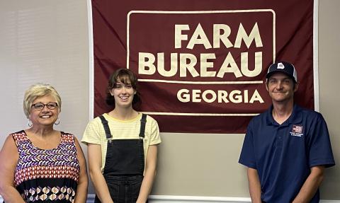 Submitted photo - From left to right, Farm Bureau office manager Tina Simmons, award winner Sydney Smith and Young Farmer & Rancher chairman Brian Fleming.