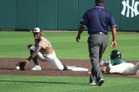Grayson Williams/The Hartwell Sun Hart County’s Malachi Thomas digs for a throw and attempts to tag out a North Hall baserunner on Wednesday, May 5 in Gainesville.