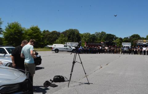 Drew Dotson/The Hartwell Sun Hart County High School media instructor Greg Gaines, left,  directs drone pilot Adian Stovall on how to capture the shot he wants.