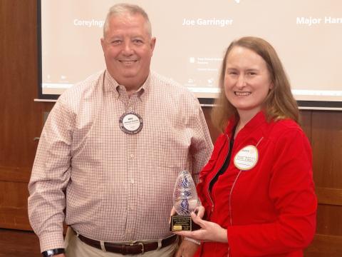 Dan Hunt/The Hartwell Sun - Ruth Daniel (right) receives the rare Service Above Self Award from Rotary president Mike Everett at Cateechee Golf Club on May 5.