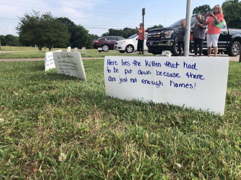 Grayson Williams/The Hartwell Sun - Residents and Humane Society reps set up signs in protest of the county’s current animal control ordinance.