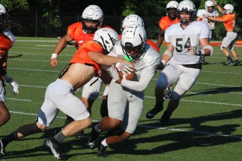 Sunshot by Grayson Williams Rising senior wide receiver Malachi Kelley tries to shake a defender as he grips the football after a catch in the Bulldogs’ spring game on Saturday, May 29 at Herndon Stadium.