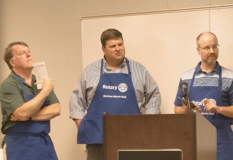 Dan Hunt/The Hartwell Sun - Jon Herschell and Brian Metzger from the Rotary spelling bee team listen to their next word assignment at the Hart County Adult Learning Center on June 17.