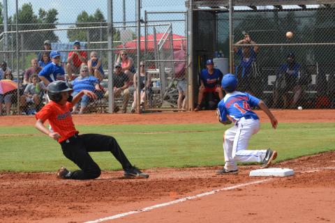 Drew Dotson/The Hartwell Sun - Axel Davis slides safe into third in his team’s win against Toccoa on June 27.
