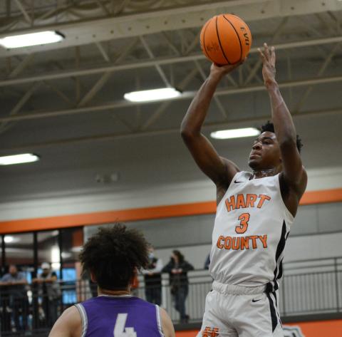 From File - Tahj Johnson pulls up for the jump shot against Cherokee Bluff on Feb. 27, 2021.