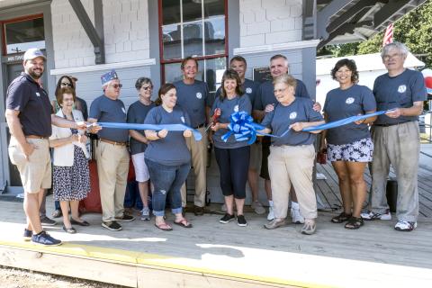 TORCH Board of Directors members cut the ribbon, marking the opening of the train depot and Railroad Street Park.