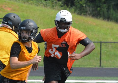 Derrick Clarke stalks a potential pass-catcher coming out of the backfield at the T.L. Hanna camp on July 22. 
