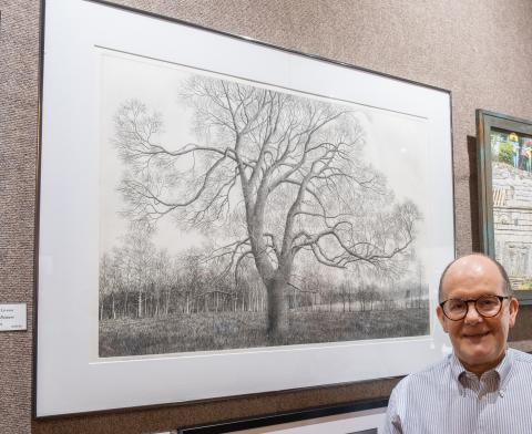 Bill Powell/The Hartwell Sun - William Livesay displays his Best in Show-winning work, Trees in a Pasture at last week’s Juried Art Exhibit.