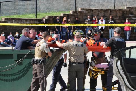Photo submitted - Detectives, firefighters, officers, coroners and more reenact a crime scene at Hart County High School on Monday, shocking students in a literature class, whose teacher was in on the scheme.