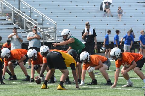 Drew Dotson/The Hartwell Sun - Hart County High School’s junior quarterback Austen Whitworth surveys the defense before the snap during a July practice. 