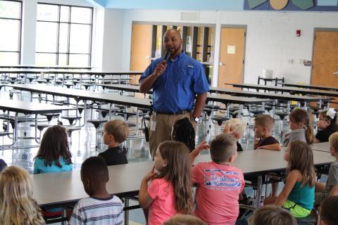 Vice principal Steve Burton talks to students at North Hart Elementary.