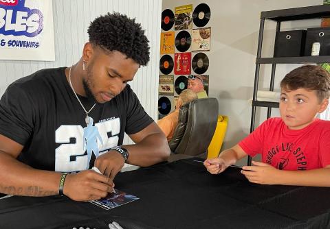 Photo Submitted Kaimon Rucker signs autographs for fans at Lake Hartwell Collectibles on July 31.