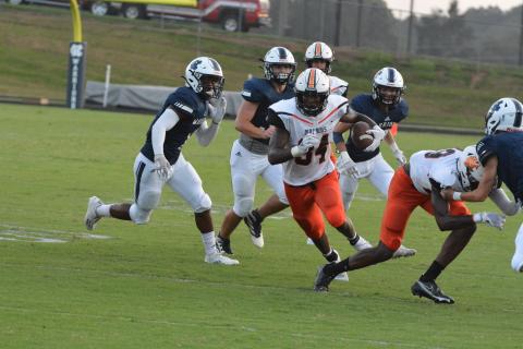 Running back JL Lackey follows his blocks to rack up 200 yards on Hart County’s win over White County on Aug. 26.