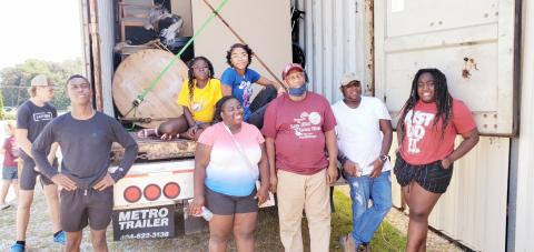 Volunteers in Lavonia on Saturday load a truck full of supplies for Haitians in need after last month’s earthquake. From left to right are Fred, Mirlanda, Belinda, Samaika, Willy (truck driver), Samuel and Redaphca.  All are students at Barnes  Academy, with the exception of Willie, a pastor from Alabama, and Samuel who is in college.