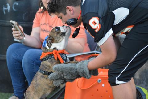 Honey shares a moment with mascot Zander Horne at the North Hall football game.