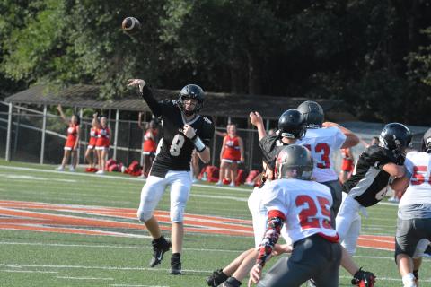 Quarterback Brice Williamson throws a pass against Madison County Middle School on Thursday, Sept. 9. 