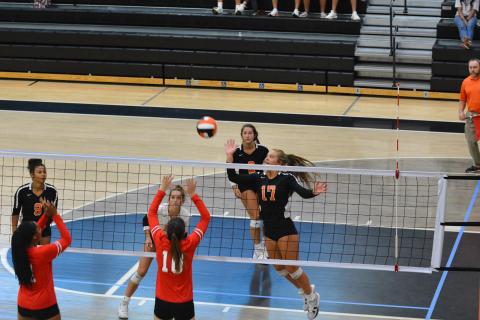 Dakota Phillips (17) taps the ball over the net against Stephens County.