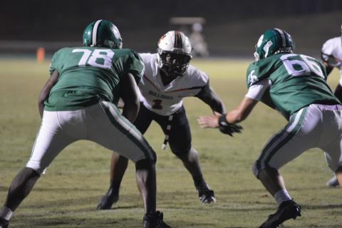 Defender Keegan Dye takes on a double team against Franklin County on Friday.