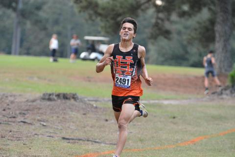 Diego Martinez slobbers like a bulldog as he approaches the finish line.