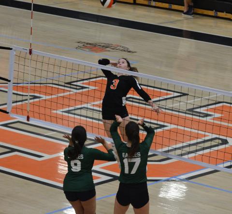 Senior Aliza raises for a spike in a home contest.