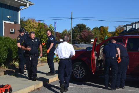 Investigators in first responders check out the scene Monday after a 95-year-old woman drove into the side wall of Hartwell Animal Hospital at 60 Leard Street.  