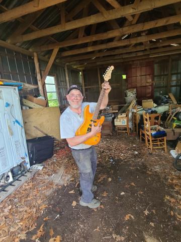 Photo submitted In his retirement, amall engines mechanic Johnny Segers enjoys picking up old hobbies like playing guitar. 