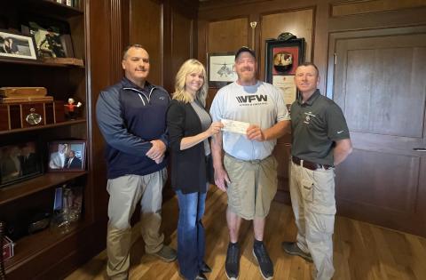 From left to right: Eric Mcallister, post quartermaster; Kelli Schell, chair of the Toughest Kids Board of Directors; Patrick Wireman, post commander and Jud Turpin, post trustee. 