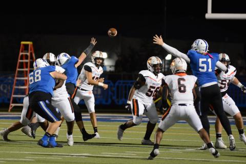 Drew Dotson/ The Hartwell Sun Quarterback Austen Whitworth threads the ball between the outstretched arms of Ringgold linemen to Malachi Kelley in the team’s loss on Nov. 12.