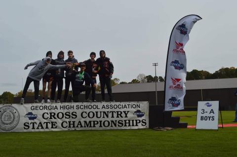 The boys pose with their third place cup.