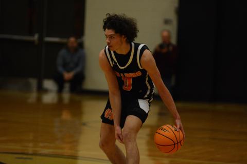 J.C. Curry eyes the T.L. Hanna defense looking for an opening.