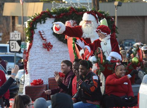 Santa, Mrs. Claus and several float-riders wave to the crowd at the 2019 Hartwell Christmas Parade. 