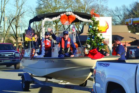 The U.S. Coast Guard Auxiliary makes its way through town as part of the 2021 Christmas parade in Hartwell. 