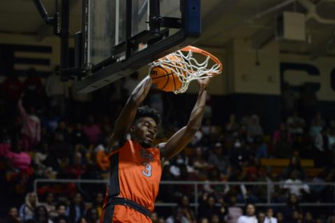 Tahj Johnson slams down two points in the team’s 53-46 win over the Elbert County Blue Devils in the Inferno, Elbert’s home court.