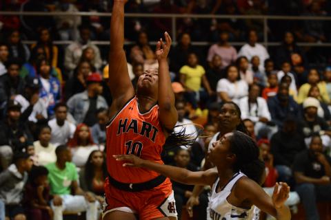 Pashay Saddler shoots off the rebound over the Elbert County defender on Dec. 17 in Elberton.