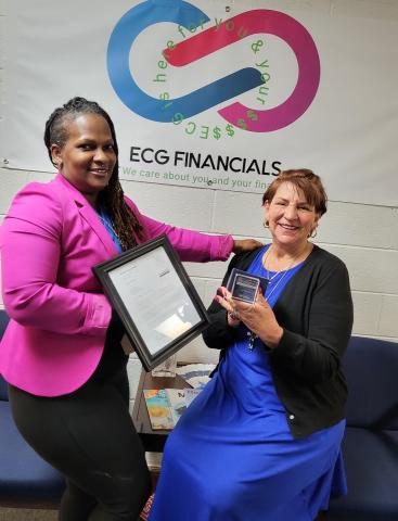Ella Goodman, left and Angela Cann, right, smile after winning the Tax Year 2020 Excellence in powering client prosperity award. 