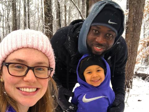 Kerv Augustin and his wife Rachel enjoy the snow with their daughter Eleanora Grace. Their youngest two, Margot and Killian, are not pictured. 