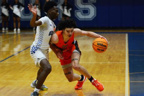 Johnny Curry draws the foul against the Oconee County defender on Tuesday, Jan. 24.