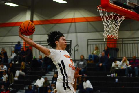 Senior Johnny Curry slams down in the 78-46 win over East Jackson on Friday night. 