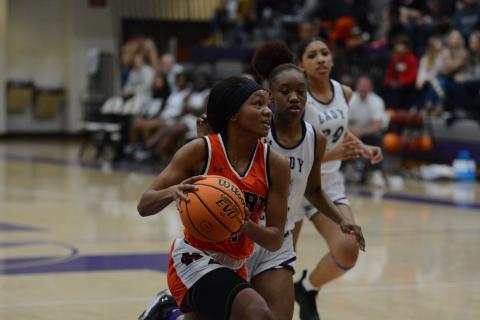 Valasha Carter drives into the paint against Monroe Area High School.
