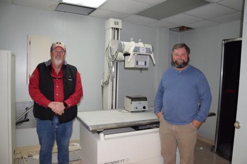 Jerry “Scoot” Rice and Scott Bailey are donating X-ray machine equipment left in the former medical building they are turning into a storage facility. 
