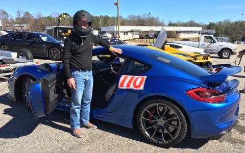 Photo submitted - Cobb, an avid sports car driver in his spare time, shows off his Porsche. 