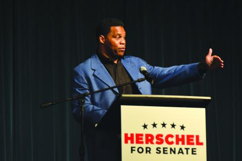 Football legend and Senatorial candidate Herschel Walker speaks at the Northeast Georgia Republican rally in Franklin Springs on Saturday. 