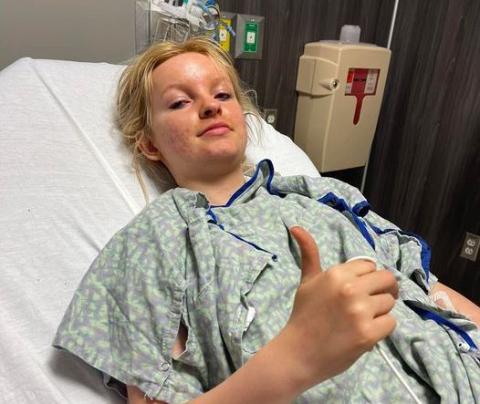 Kaylee Worley, 16, gives a thumbs up at Greenville Hospital hours after braving a racing accident at Lavonia Speedway on Saturday, Feb. 19. 