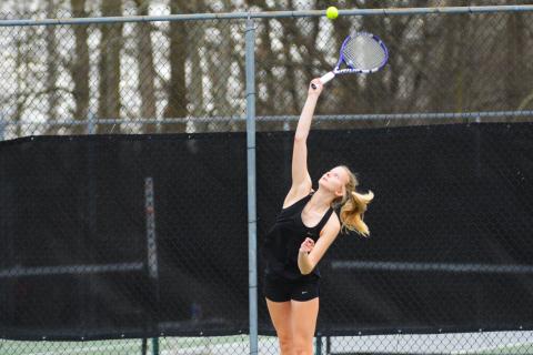 Ava Carnes serves in her win over Elbert County.