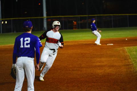 Drew Dotson/ The Hartwell Sun - Peyton Powell rounds third against Athens Christian on Feb. 15. 