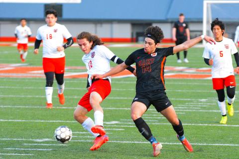 Tyler Trujillo fights for possession against the Rabun County player.